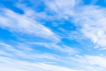 Blue sky with white clouds on a sunny day. Natural background - obrazy, fototapety, plakaty