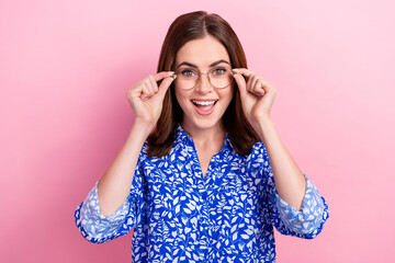 Photo of astonished cheerful girl arms touch glasses open mouth isolated on pink color background