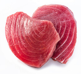 Fresh tuna steaks isolated on white background.