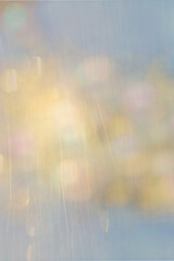 Abstract, blue, gold and pink bokeh with light scratches