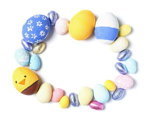 Frame made of painted Easter eggs on white background