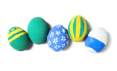 Painted Easter eggs on white background, top view