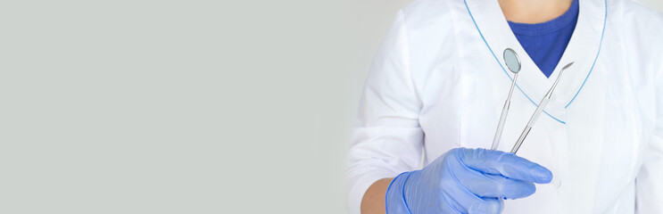 Fototapeta premium Dentist Professional tools medical equipment in doctor hand. Dental Hygiene and Health conceptual image