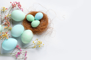 Naklejka na ściany i meble Composition with painted Easter eggs and gypsophila flowers on white background