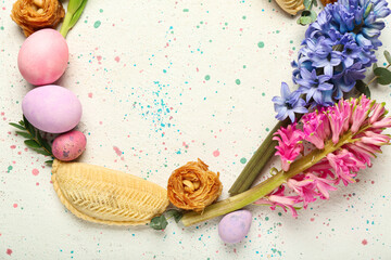 Fototapeta na wymiar Frame made of flowers, eggs and treats on grunge background. Novruz Bayram celebration