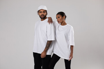 African american couple in white t-shirts. Man in white panama. Mock-up.