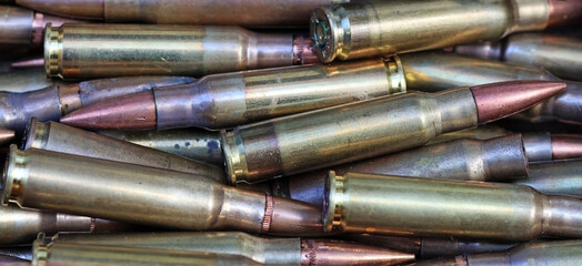 Fototapeta premium Lots of unused bullet cartridges, war concept, firearms