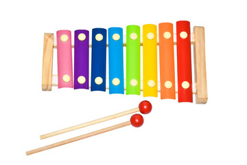Children's toy xylophone with playing sticks on a white background