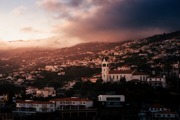 drone view of funchal night city, lights and darkness