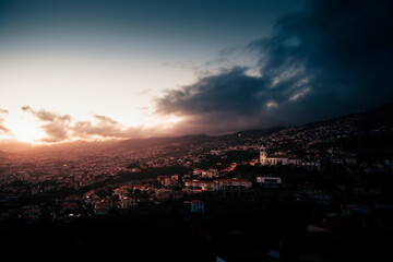 drone view of funchal night city, lights and darkness