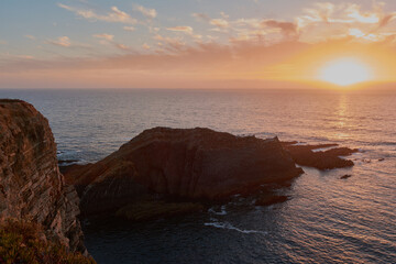 Fototapeta na wymiar Stunning sunset over the ocean. West of Algarve, Portugal