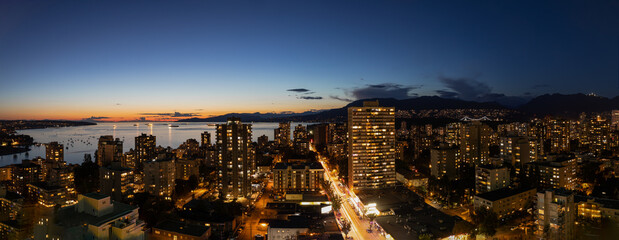 panoramic view from above over Vancouver skyline at night