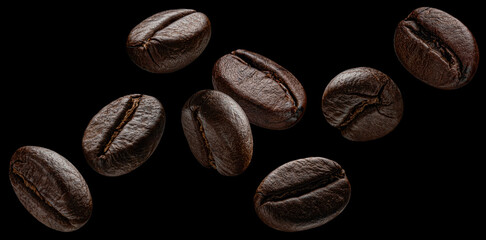 Falling coffee beans isolated on black background