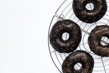 black bagels with poppy seeds isolated on white background