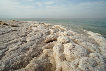 Dead Sea panoramic view with piles of mineral salt, Jordan and Israel, Dead Sea