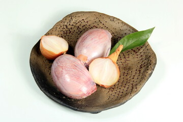 Raw bull testicles on clay plate