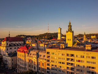 Naklejka premium Aerial view of architecture of Lviv by drone. Summer Ukraine Lviv region, West Ukraine. Sunset.