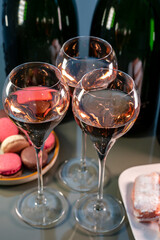 Tasting of rose brut Champagne sparkling wine in cellars of gran cru wine house in Epernay, wine tour in Champagne, France