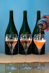 Tasting of rose brut Champagne sparkling wine in cellars of gran cru wine house in Epernay, wine tour in Champagne, France