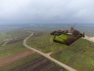 Winter view on Moulin de Verzenay and gran cru vineyards of famous champagne houses in Montagne de...