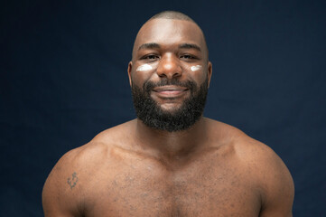 Muscular African Handsome bearded Skincare Smiling
