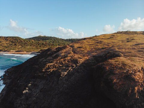 Beautiful island coast shore and water texture topdown known as la zanja from puerto rico in golden hour