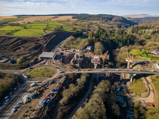 MERTHYR TYDFIL, WALES - FEBRUARY 06 2023: Aerial view of a roundabout and major roadworks at section 5 of the A465 "Heads of the Valleys" road in South Wales, UK
