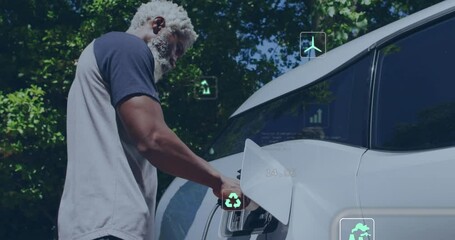 Animation of data processing and ecology icons over senior african american man fueling car - Powered by Adobe