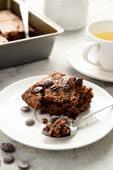 Slice of brownies with chocolate chips and rolled oats. Homemade healthy dessert.