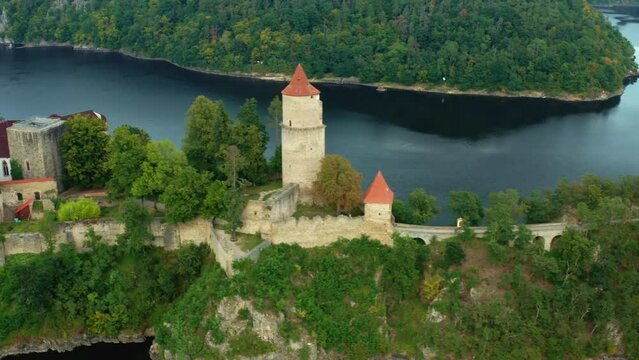 Camera side moving along Zvikov Castle on the hill surrounded by river Vltava and Otava in South Bohemia region in Czech Republic