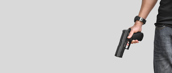 Isolated 9mm pistol gun holding in right hand of gun shooter with clipping paths.