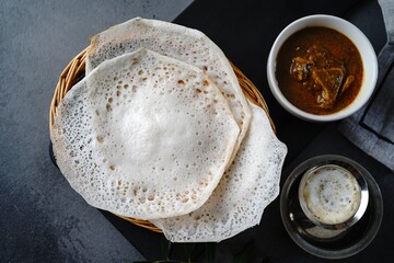 Kerala breakfast appam or palappam with mutton curry
