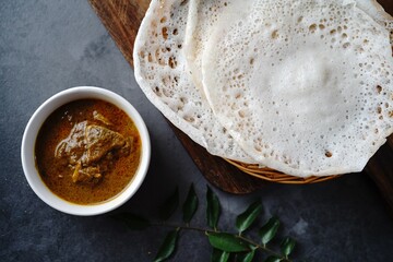 Kerala breakfast appam or palappam with mutton curry