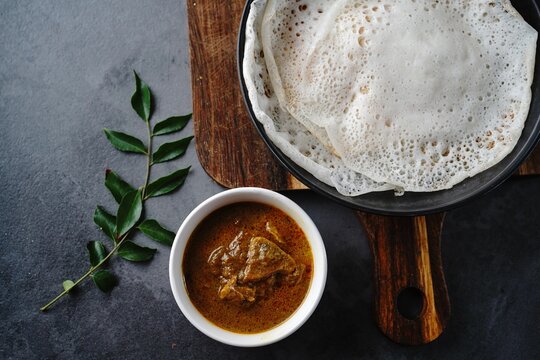 Kerala breakfast appam or palappam with mutton curry