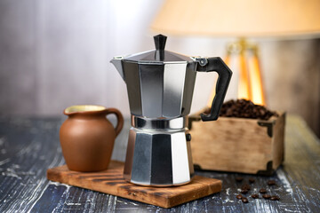 geyser coffee maker and Fragrant Coffee Beans . The process of making coffee in a geyser coffee maker. close-up. selective focus.