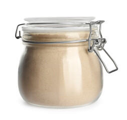 Glass jar of buckwheat flour isolated on white