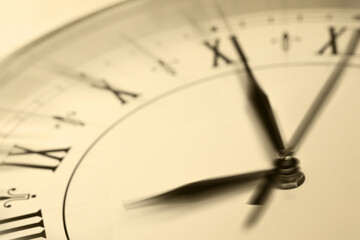 Fototapeta premium Fleeting time concept. Clock on light background, closeup. Motion effect