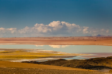 Salt lake, volcanic landscape at Sunset, Atacama, Chile border with Bolivia