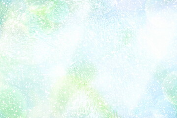 グリーンと水色の質感のあるキラキラ光の背景