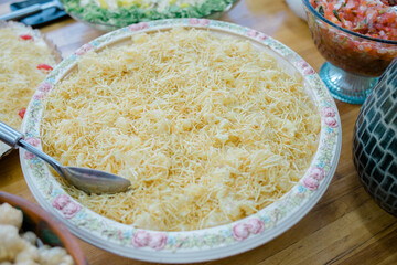buffet with chicken sausage, mashed potatoes and straw potatoes