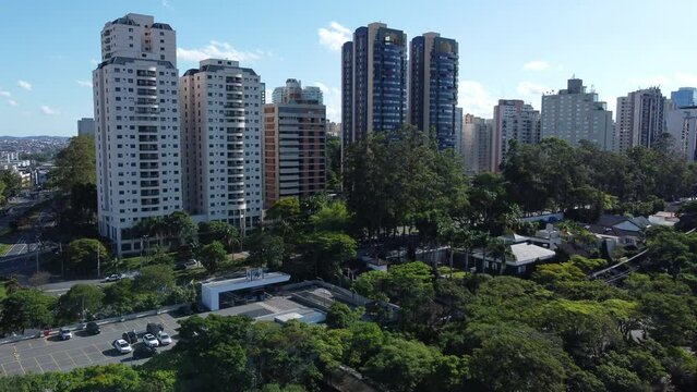 Aerial Shot Passing Over Residential Buildings, Street And Luxury Houses