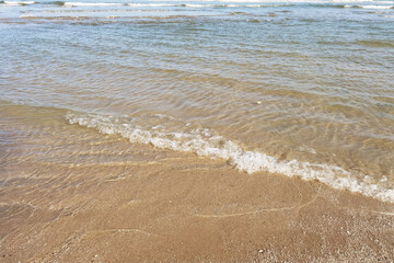 Wave of the sea on the sand beach