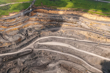 Panoramic aerial view of coal mine. Open pit mine industry, big yellow mining truck for coal...