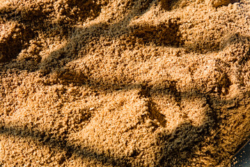 drying of grinded cumin seeds in the sun rays in india