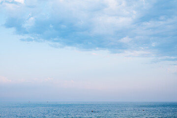 Background of sky and sea, sea is very calm with gentle ripples, sky perfectly clear.