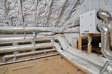 High efficiency energy recovery ventilator (ERV) and heating/cooling system in insulated home attic
