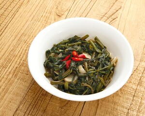 Tumis Kangkung, Ca Kangkung, Indonesian food. Served on white bowl.
