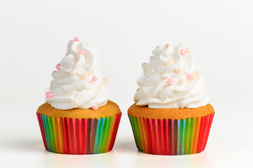 Delicious birthday cupcakes isolated on white.