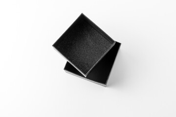 Packing in an open black gift box, black box on white background
