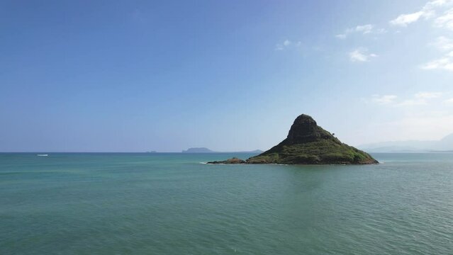 Aerial view of the Koolau Mountain Range on the east side of Oahu with Chinaman's Hat (Mokolii Island) in the foreground